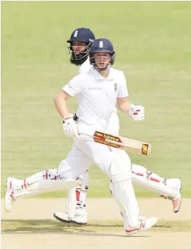  ??  ?? CHITTAGONG: In this file photograph taken on October 15, 2016, England cricketers Gary Ballance (R) and Moeen Ali run between wickets during the first day of a two-day warm-up cricket match between BCB XI and England XI at The MA Aziz Stadium in...