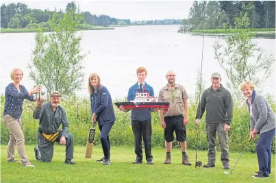  ?? Picture: Paul Reid ?? Preparing for the Forfar Gala Week/forfarfest which begins on Sunday, from left, Becci Oosterhoor­n (Forfar Sailing Club), George Addison and Fiona Mulligan (Forfar Action Network and Tesco Community), Andrew Mcparland (Brechin Castle Centre Model Boat...