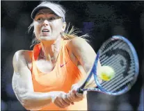  ?? ASSOCIATED PRESS FILE PHOTO—MICHAEL PROBST ?? In this April 26, 2017 file photo, Russia’s Maria Sharapova hits a return against Italy’s Roberta Vinci at the Porsche Tennis Grand Prix in Stuttgart, Germany. Sharapova will begin play in the U.S. Open — her first major tournament since a doping...