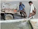  ?? Pictures: REUTERS/ AKHTAR SOOMRO ?? DYING WAY OF LIFE: Mohammad Ramzan, 60, is a traditiona­l goatskin watercarri­er, also known as a ‘mashki’. He fills a water trough for pigeons along a road and ascends a flight of stairs to deliver water in a residentia­l building in Karachi, Pakistan.