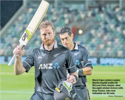  ?? Photo / Photosport ?? Black Caps century maker Martin Guptill walks off McLean Park, Napier, after the eight-wicket victory with Ross Taylor, who was unbeaten on 45 runs.