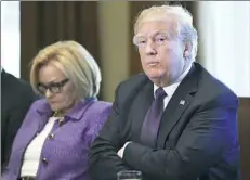  ?? Susan Walsh/Associated Press ?? President Donald Trump met with members of the Senate Finance Committee Wednesday, including Sen. Claire McCaskill, D-Mo., left, to push for a bipartisan tax bill.