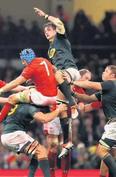  ??  ?? Franco Mostert wins a line out ball for South Africa against Wales