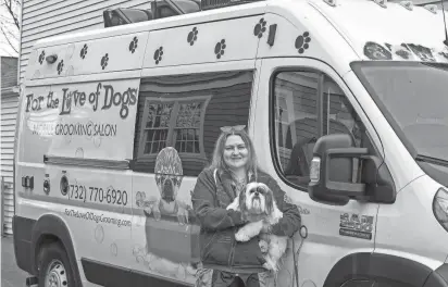  ?? PHOTOS BY TANYA BREEN/ASBURY PARK PRESS ?? Cathy-Anne Collins, owner of For the Love of Dogs, a mobile pet grooming business based in Atlantic Highlands, holds her 8-year-old malshi, Dottie, outside of a client's home in Rumson.