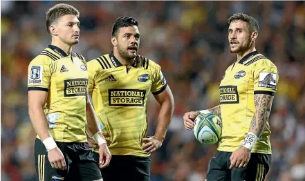  ??  ?? Beauden Barrett, left, with Chase Tiatia and TJ Perenara during the Hurricanes’ match against the Chiefs last Friday.