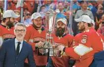  ?? JOHN MCCALL/SOUTH FLORIDASUN SENTINEL ?? Panthers center Aleksander Barkov and right wing Matthew Tkachuk, right, hoist the Prince of Wales trophy after defeating the Hurricanes in Game 4 to win the Eastern Conference finals Wednesday at FLA Live Arena in Sunrise.