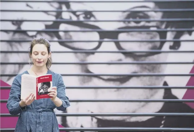  ??  ?? 0 National Library of Scotland exhibition­s officer Ciara Mckenna was brushing up on her Muriel Spark ahead of today’s opening of an exhibition about the author