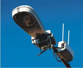  ?? BLOOMBERG VIA GETTY IMAGES ?? A camera-equipped Smart Streetligh­t in the Gaslamp District is shown in this 2020 photo. The fact that the devices were installed around San Diego without the public being told they were surveillan­ce tools led to the city’s Privacy Ordinance.