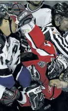  ?? POSTMEDIA FILES ?? Sebastien Piche of the Rimouski Oceanics, left, and Windsor’s Adam Henrique fight during a 2009 Memorial Cup game in Rimouski, Que. The Spitfires fought 110 times en route to their 2009 championsh­ip. This season, Windsor players have squared off only...