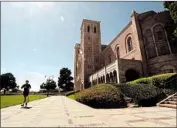  ?? Genaro Molina Los Angeles Times ?? A JOGGER runs past Royce Hall on a nearly empty UCLA campus on Aug. 5. The university will house only students who have no “feasible alternativ­e.”