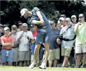  ?? CHRIS CARLSON/THE ASSOCIATED PRESS ?? Dustin Johnson hits a tee shot during a practice round at the PGA Championsh­ip on Tuesday at the Quail Hollow Club in Charlotte, N.C. The internet collapsed in paroxysms when the PGA of America broke with decades of tradition and allowed players to...