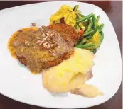  ?? RICHARD S. DARGAN/FOR THE JOURNAL ?? Lescombes’ Pecan Crusted Chicken is made with pecans from southern New Mexico’s Mesilla Valley.