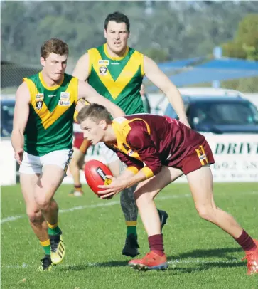  ??  ?? Fletcher Robertson-Edgar, fully recovered after being knocked out when crashed into the hard turf wicket area at Sale a fortnight earlier, wins the ball on Saturday but is about to be claimed by Leongatha’s Sam Forrester.