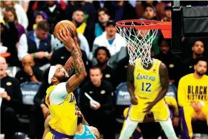  ?? PHOTO BY DAVID JENSEN/AFP ?? HOME FREE
Anthony Davis of the Los Angeles Lakers dunks the ball during the first half of a game against the Charlotte Hornets at Spectrum Center on Monday, Feb. 5, 2024, in Charlotte, North Carolina.