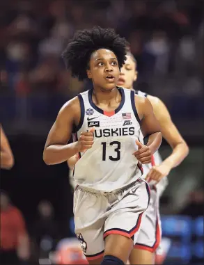  ?? Elsa / Getty Images ?? UConn’s Christyn Williams runs off of the court at the end of the second quarter against Arizona in the national semifinals on April 2 in San Antonio, Texas.