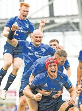  ?? Picture: Gallo Images ?? JOIN THE QUEUE. Leinster’s Josh van der Flier (bottom) celebrates with team-mates after scoring a try during their United Rugby Championsh­ip match agasinst the Bulls in Dublin on Saturday.