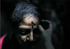  ?? Inti Ocon/AFP/Getty Images ?? A woman participat­es in the celebratio­n of Ash Wednesday at the cathedral in Managua last week.