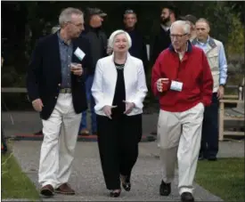  ?? THE ASSOCIATED PRESS ?? Federal Reserve Chairwoman Janet Yellen, center, strolls with Stanley Fischer, right, vice chairman of the Board of Governors of the Federal Reserve System, and Bill Dudley, the president of the Federal Reserve Bank of New York, before Yellen’s speech...