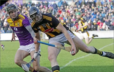  ??  ?? Joe O’Connor staying close to Walter Walsh in Chadwicks Wexford Park on Sunday. The St. Martin’s clubman and his team-mates will begin the defence of their Pettitt’s Senior hurling championsh­ip title against Rathnure in early April.