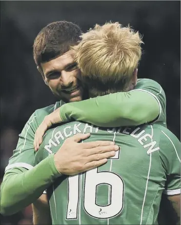  ?? Picture: SNS ?? After setting up Celtic’s winning goal, Nadir Ciftci embraces scorer Gary Mackay-steven