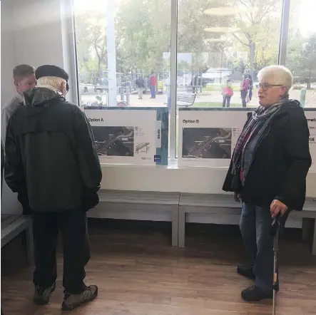  ?? DUSTIN COOK ?? Lansdowne resident Lorraine Sorensen, right, got a look Tuesday at concepts for access to Whitemud Drive Path from Lansdowne Drive. She says she would prefer an option accessible to seniors.