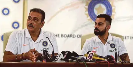  ?? AFP PIC ?? India head coach Ravi Shastri (left) and captain Virat Kohli at a press conference ahead of the team’s departure to England to play in the World Cup.