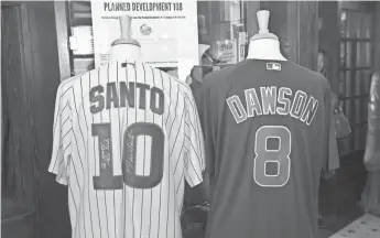  ??  ?? DAVID BANKS, USA TODAY SPORTS Two Cubs jerseys are displayed together to show the number 108. Grant DePorter, CEO of Harry Caray’s Restaurant Group, has created a list of “108” appearance­s related to the Cubs.