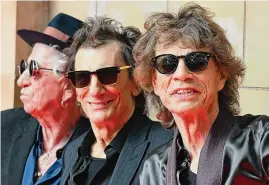  ?? Daniel Leal/AFP/Getty Images/TNS ?? From left, Keith Richards, Ron Wood and Mick Jagger of the Rolling Stones arrive at a launch event for their upcoming album in London on Wednesday.