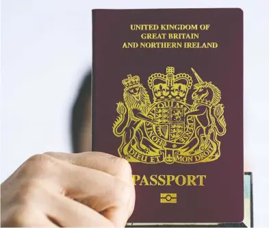  ?? ANTHONY WALLACE / AFP VIA GETTY IMAGES ?? China says it will “no longer recognize” the British National (Overseas) passport for Hong Kongers.