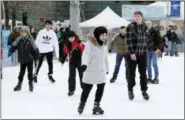  ?? CARLOS OSORIO — ASSOCIATED PRESS ?? People skate at the Campus Martius ice rink in Detroit last month.