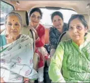  ?? PTI ?? Arvind Kejriwal's wife Sunita (right) and mother (left) wait in car near the LG’s residence in New Delhi on Thursday.