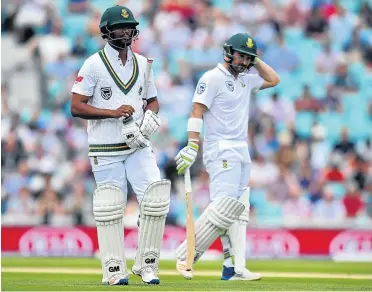  ?? Picture: AFP ?? South Africa’s allrounder Vernon Philander, left, walks back to the pavilion after losing his wicket on the final day of the third test match against England at The Oval in London on Monday. Next to him is teammate and top-order batsman Dean Elgar.