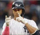  ?? KATHY WILLENS — ASSOCIATED PRESS ?? The Yankees’ Giancarlo Stanton points to his teammates after hitting a double in the seventh inning against the Athletics on May 13.