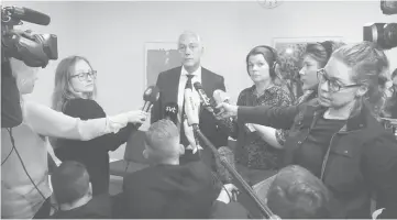  ??  ?? Eriksson (centre) speaks to the media at the court after the detention hearing of the suspect in Friday’s attack in Stockholm.— Reuters photo