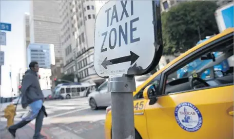  ?? Robert Gauthier Los Angeles Times ?? A BILL PASSED by the state Assembly would consolidat­e taxi permit fees and allow demand-based ride pricing, similar to Uber and Lyft.