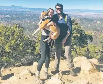  ?? COURTESY PHOTO ?? Emily Goleski and Jack Satterfiel­d pose with their dog, Landon.