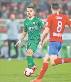  ??  ?? Nico Yennaris of Beijing Guoan controls the ball against Henan Jianye during their Chinese Super League match in Beijing, in this April 14 file photo. — AFP photo