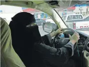  ?? [AP PHOTO] ?? Mabkhoutah al-Mari drives to work for the first time Sunday in Riyadh, Saudi Arabia. “It feels beautiful. It was a dream for us so when it happens in reality, I am between belief and disbelief — between a feeling of joy and astonishme­nt,” said Mari as...