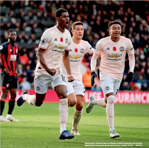  ?? Reuters ?? Manchester United’s Marcus Rashford (left) celebrates the winner against Bournemout­h during the Prenier League match. —