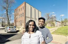  ?? AMY DAVIS/BALTIMORE SUN ?? Sonia and Curtis Eaddy Sr. outside their historic home in the 300 block of North Carrollton Avenue. The city’s Commission for Historical and Architectu­ral Preservati­on voted Tuesday to have its staff look into adding the Eaddys’ home in Poppleton to a proposed historic district.