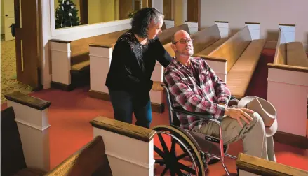  ?? JOHN AMIS/AP 2022 ?? Laura Lamb and her husband, Jerry, make their way into the sanctuary of Camden First United Methodist Church in Camden, Tennessee.