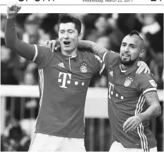  ??  ?? Bayern Munich’s Robert Lewandowsk­i (left) celebrates his goal with Arturo Vidal during the German Bundesliga football match against Eintracht Frankfurt in Munich, southern Germany. — Reuters photo