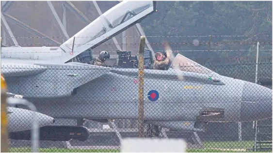  ??  ?? Ready to go... Tornado jet pilots returning to RAF Marham in Norfolk yesterday as they prepare for a possible strike on Syria