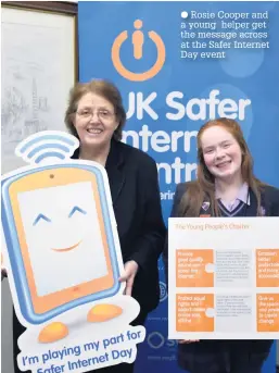  ??  ?? Rosie Cooper and a young helper get the message across at the Safer Internet Day event