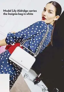  ??  ?? Model Lily Aldridge carries the Insignia bag in white