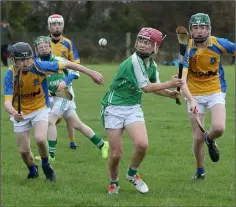  ??  ?? David Redmond (Cloughbawn) under pressure from Shane Codd and Jack Kelly (Taghmon-Camross).