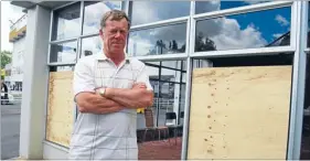  ?? Photos: CIARA PRATT ?? Senseless act: Avondale Jockey Club secretary-manager John Craig stands in front of boarded up windows, a result of repeated vandalism.