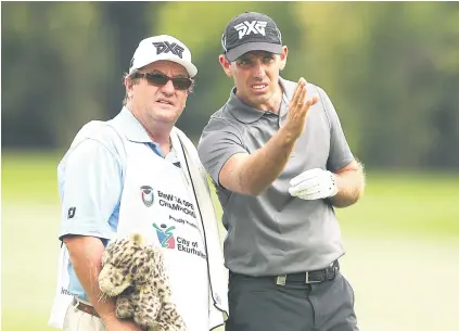  ?? Picture: Gallo Images ?? SINGLE-MINDED. Charl Schwartzel, pictured here with his caddie during a pratice round at Glendower Golf Club yesterday, is desperate to add the SA Open title to his CV.