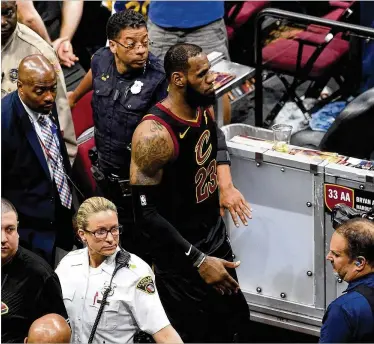  ?? JASON MILLER / GETTY IMAGES ?? LeBron James (walking off the court after Golden State’s title-clinching win over Cleveland) seems likely to send the Cavs into another tailspin with his exit, while lifting the hopes of other East contenders.