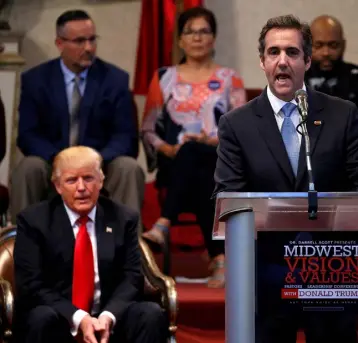  ??  ?? ARM-TWISTING: Michael Cohen and Donald Trump on the campaign trail in September 2016